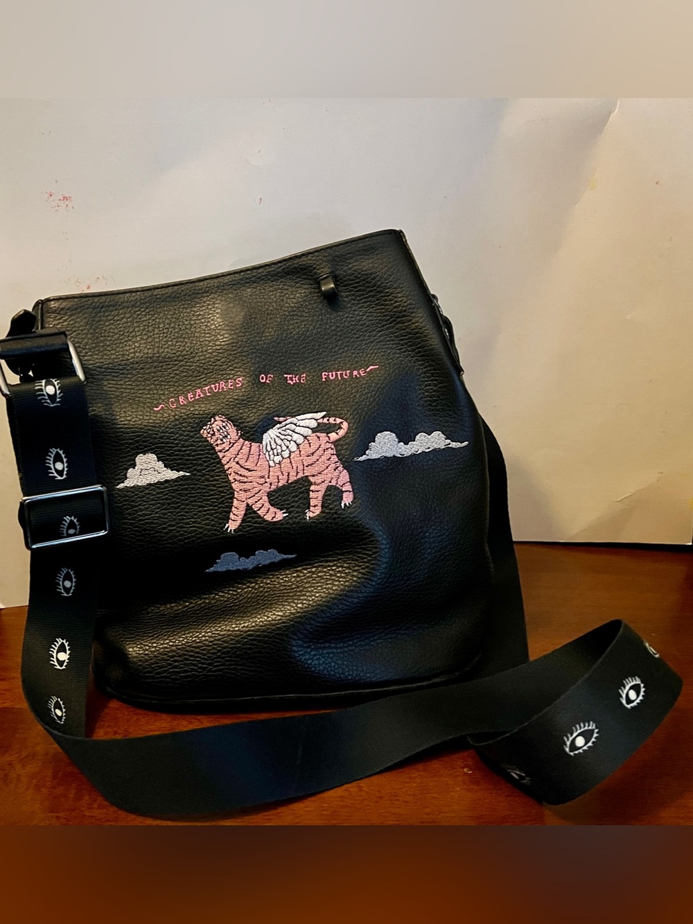Min & Mon Creatures of the Future black leather Vincent bucket bag- winged tiger